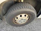 a tire that is sitting on the side of the road