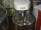 an image of a mixer in a kitchen with other appliances