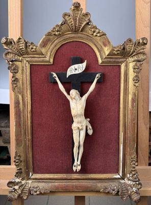 a wooden crucif with a banner on it