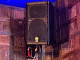 a speaker that is sitting on the wall of a room
