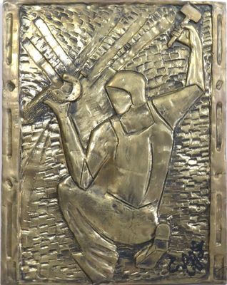 a close up of a metal plaque with a person holding a baseball bat