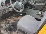 a yellow car with a steering wheel and a dashboard