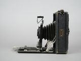 an old camera sitting on top of a pallet