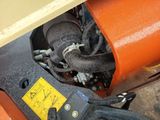a close up of a machine with a yellow label on it