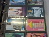 a lot of credit cards sitting on a binder