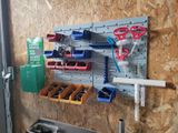 a picture of a wall mounted tool rack with many tools