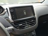a dashboard of a car with a steering wheel and dashboard controls