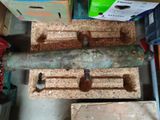 two pieces of wood that are sitting on a table
