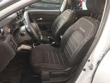 the interior of a car with two black seats and a steering wheel