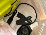 a yellow bag with a black handle and a yellow bag with a black handle and a yellow bag with a black handle and a yellow bag with a black