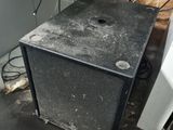 a small black box sitting on the floor in a room