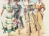 three women in dresses and hats are walking on the beach