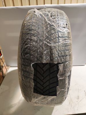 a helmet that is wrapped in plastic and sitting on a table