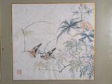 two birds sitting on a branch of a tree