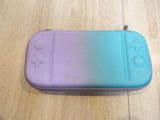 a purple and blue case sitting on a wooden floor
