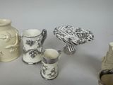 four vases that are sitting on a table