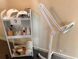 a picture of a room with a table and a lamp
