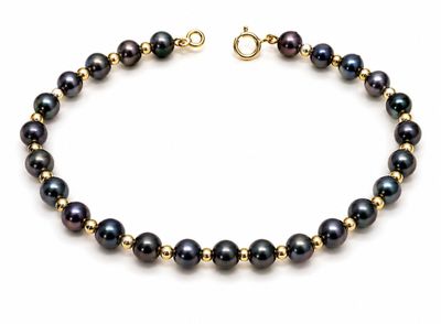 a black pearl bracelet with a gold plated clasp