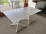 a white table with a white top in a room