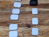 a wooden table with a number of white rocks on it
