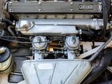 a close up view of a car engine with the hood up