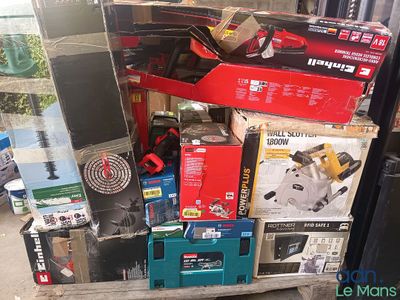 a pile of boxes and tools on a pallet next to a window