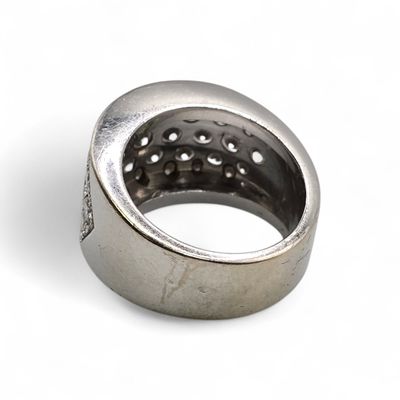an image of a silver ring with holes in it