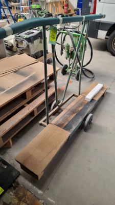 several pieces of wood are stacked on a pallet in a warehouse