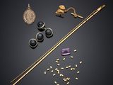 a collection of jewellery including a wand, earrings and a necklace