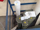 a metal box filled with pipes and other items