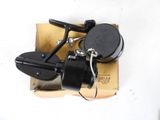 a small black fishing reel on top of a box