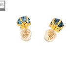 a pair of earrings with blue stones and pearls on a white background