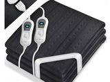 a picture of a blanket with a pair of remotes plugged into it