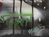 a close up of a motorcycle with graffiti on it