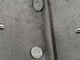 a black and white photo of a jacket and tie