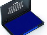 the blue ink pad is in a black case on a white surface