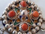a picture of a necklace that is on a table