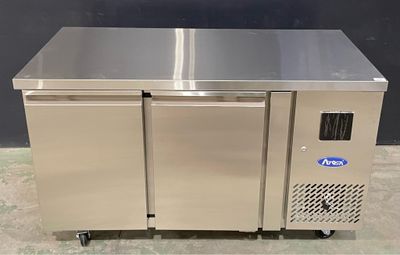 an image of a stainless steel counter top freezer with two doors