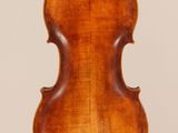 an old violin with a wooden back and a long neck