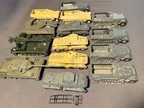 a lot of toy army vehicles on a table