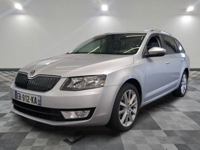 a picture of a silver car parked in a showroom