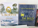 several books are sitting on a table next to each other