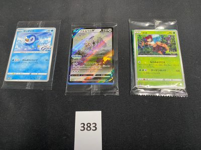 three different types of pokemon cards are on a black surface