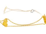 a close up of a gold chain bracelet on a white background