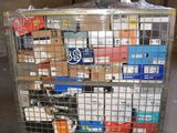 a metal cart with many boxes on it in a warehouse