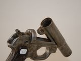 a gun that is on top of a table