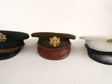 three hats sitting on top of each other on a table