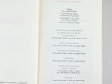 an open book with a menu in it on a table