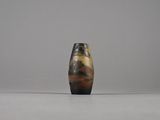 a small vase that is sitting on a table