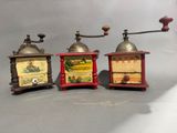 three different types of coffee grinders on a table